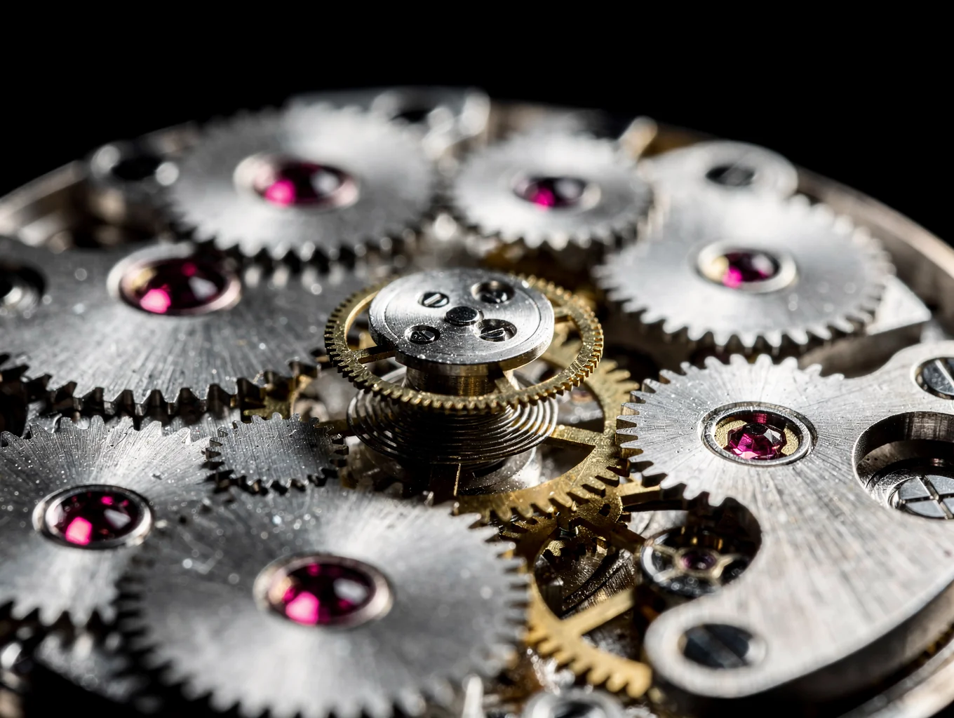 Macro photograph of watch escapement wheel with synthetic ruby jewels